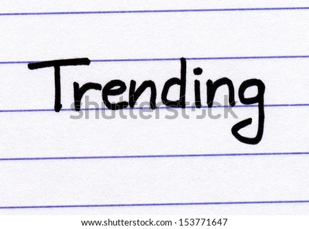 Trending written in black ink on white lined paper.