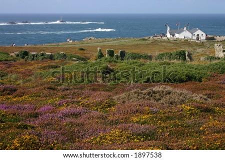 Looking towards the first and last house in England and Longships lighthouse, Land's End, England