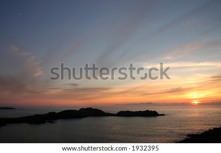 Sunset skies and crescent moon over Shipman Head, Bryher, Isles of Scilly