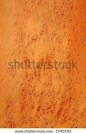 Vivid orange rusty pitted metal background
