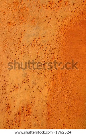 Orange rusty pitted metal background