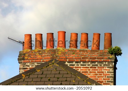 Old brick chimney stack and analogue TV aerial