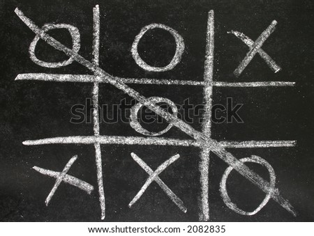 Noughts and crosses game played on a blackboard