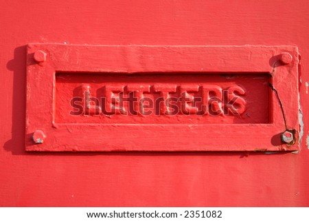 A red letter box cover.