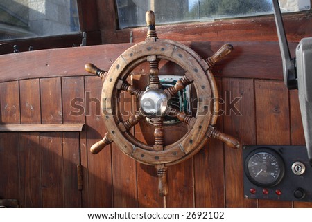 Old boat wheel and a knots meter.