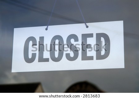 Closed sign in a shop window.