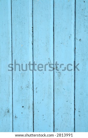 Light blue painted wooden door close up background.