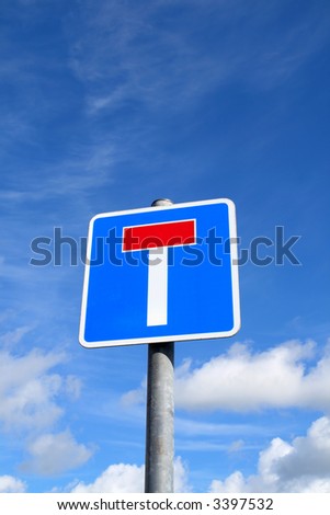 British no through road sign and a blue sky.