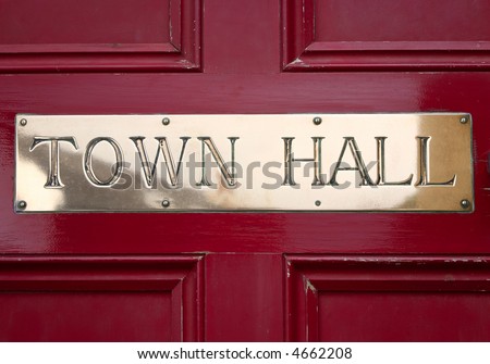 Brass Town Hall sign on a door.
