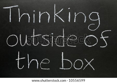 Thinking outside of the box written on a blackboard.