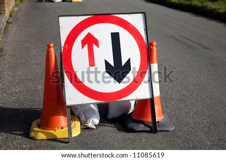 British give way to oncoming vehicles sign