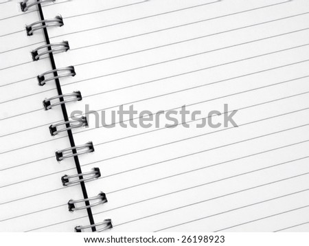 Close up of lined paper in a spiral notepad.
