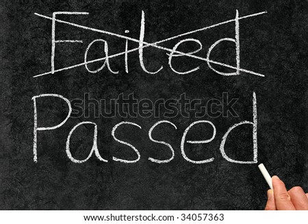 Crossing out failed and writing passed on a blackboard.