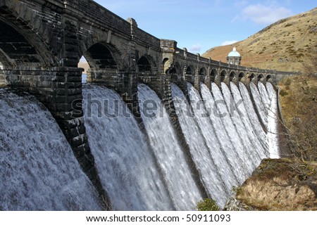 Craig Goch dam overflowing with water, Elan Valley Wales.