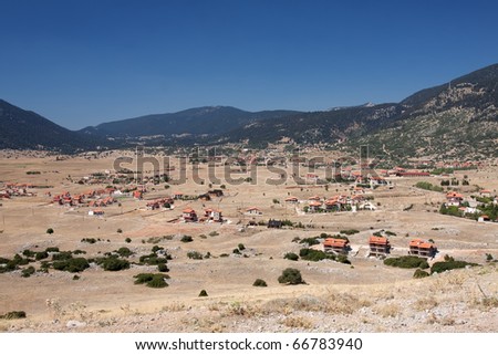 Little houses on a small plateau of mountain Parnassos, near the winter Greek resort of Arachova