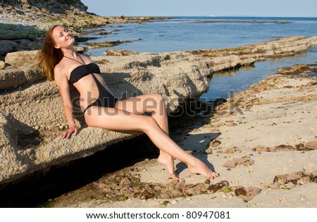 young pretty lady relaxing on the sea