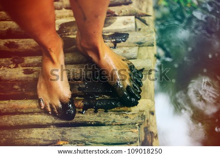 Feet girl in the mud bog.