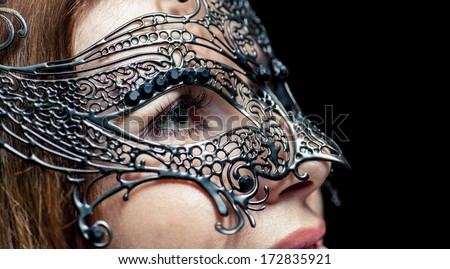 Venetian mask on  face of the girl,