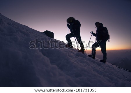 Hiker in a winter mountain .