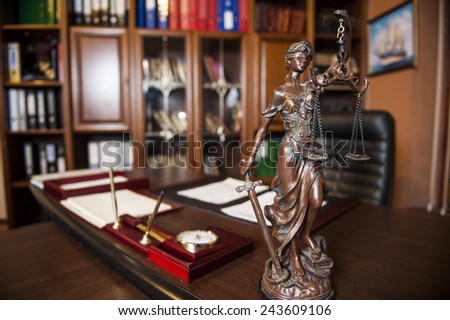 Statue of justice in the judge\'s chambers.