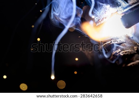 Sparks from welding close-up.