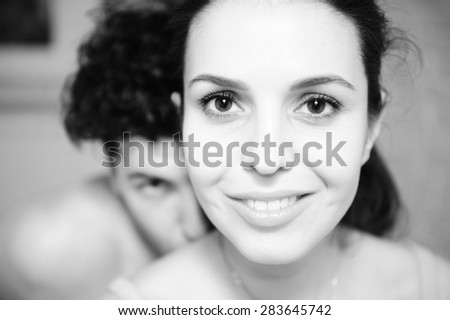 man and woman looking into the camera. Black and white picture