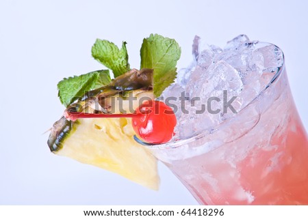 cocktail iced cherries and pineapple mint in a beautiful dessert gless