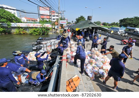 AYUTTAYA, THAILAND - OCT 22: Thai military transport food supplies to help people after the city was flooded during the monsoon season on October 22, 2011 in Bangkok, Thailand.