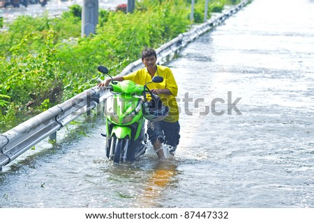 PRATHUMTHANI, THAILAND - OCTOBER 22: Heavy flooding from monsoon rain in Ayutthaya and north Thailand arriving in Bangkok suburbs on October 22, 2011 in Prathumthani, Thailand.