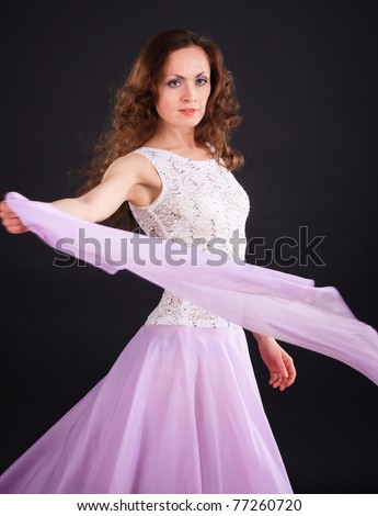 Portrait of beautiful woman in a lilac dress with scarf