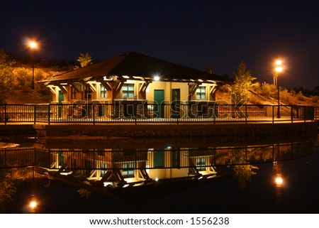 Building reflecting on water at River Walk Park in Bakersfield California