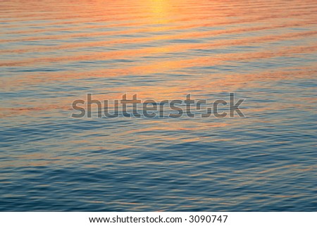 Reflections of sunset on body of water