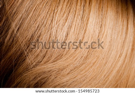 blonde combing her hair