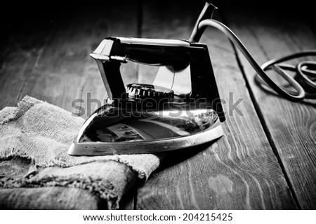 Old electric iron, touch-up in retro style. Black and White Photography