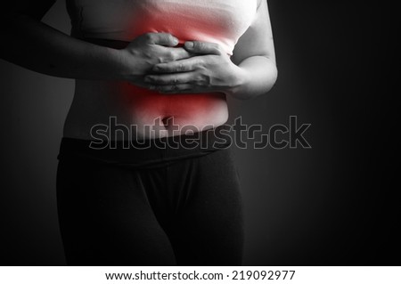 Lady abdominal pain. Black and white