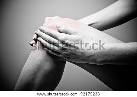 Young woman having knee pain