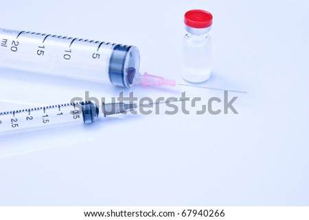 two hypodermic needle and medicine one bottle