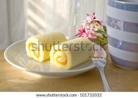 roll cake set put on table with sunlight at noon