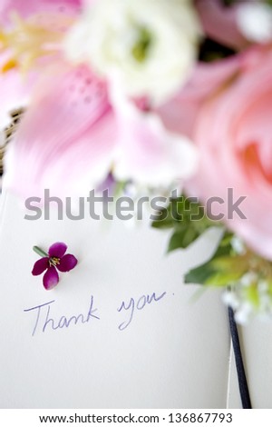 floral in the foreground with thank you note