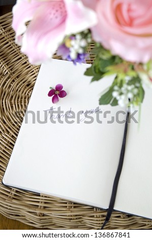 thank you note on white page with pink blossom