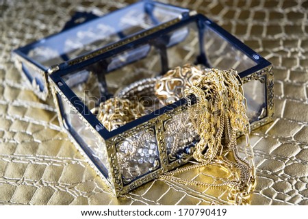 gloden jewelry in treasure chest