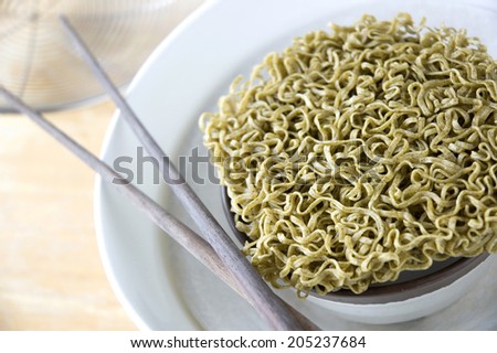close up uncooked green noodles