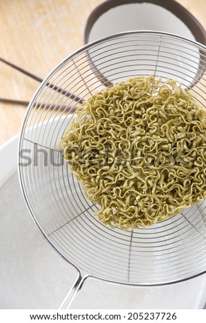 prepare to cook instant green noodles for meal