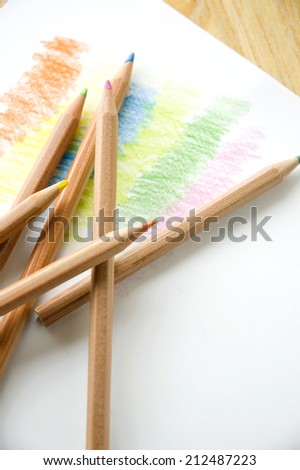 many color of colored pencil put on paper coloring background