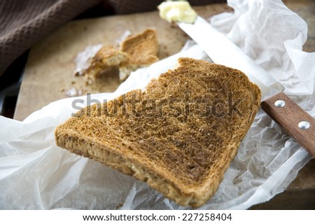 close up burn crispy bread toast in messy kitchen