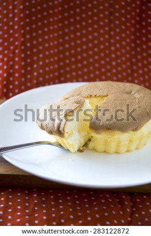 share piece of sponge cake on dish