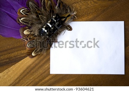 blank white space for text decorated with purple feathers