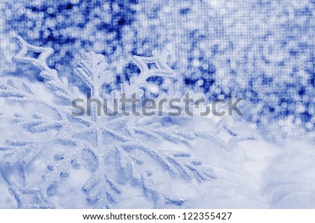 Snowflake big close up. Bokeh a background. Toning is blue