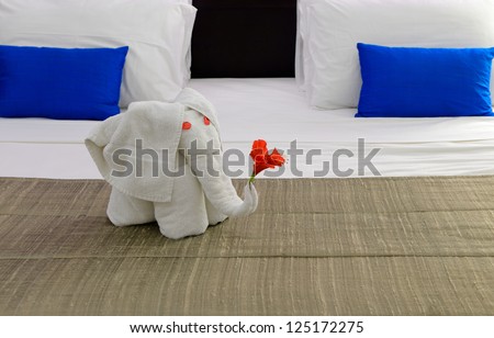 room in a hotel with an elephant from the towel on the bed . The tropical island of Sri Lanka