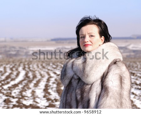 The woman in a fur coat. A fur coat from arctic fox